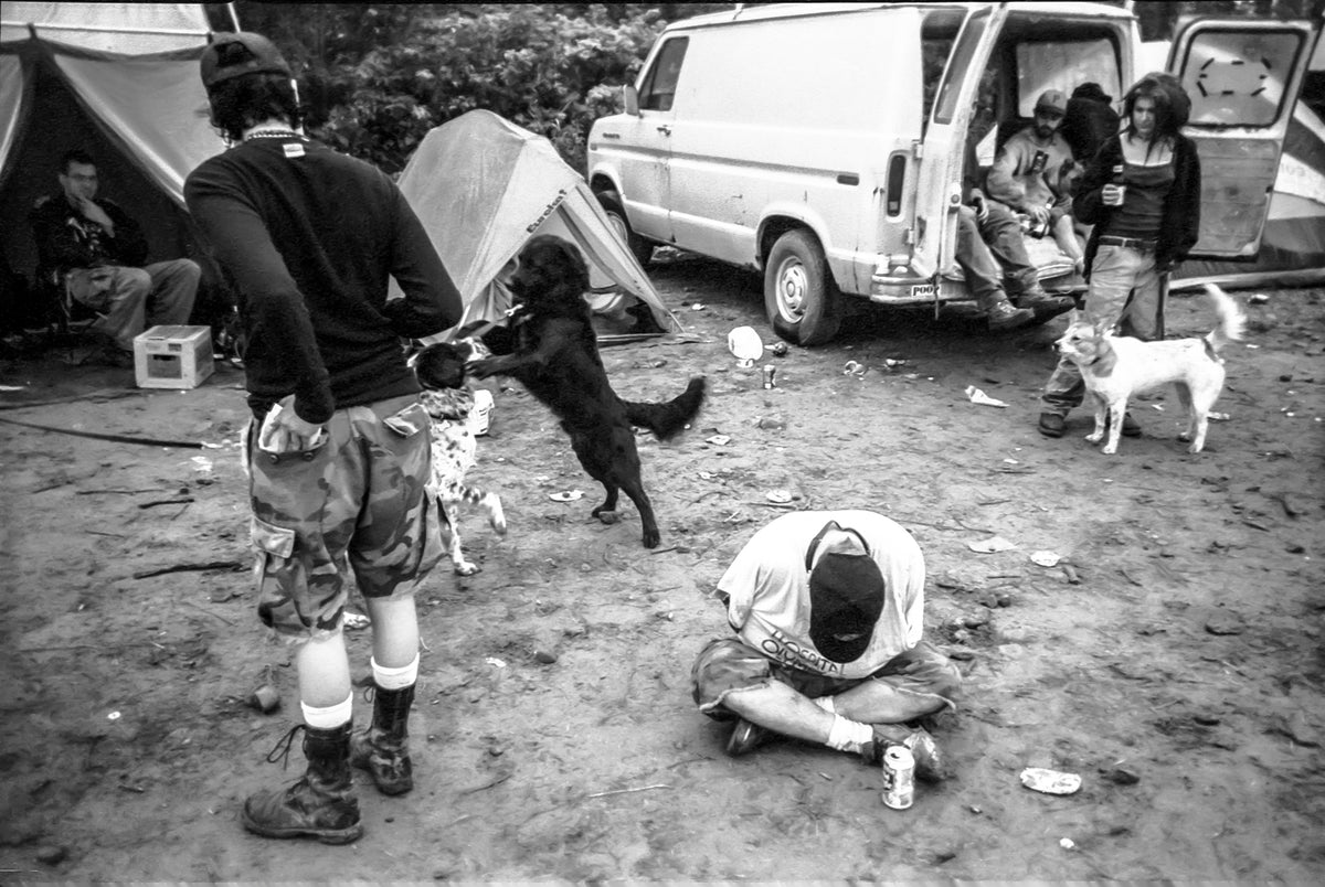 Punkfest - Eau Claire, WI - Punks and dogs lounge on the festival grounds. Photo by John Veit