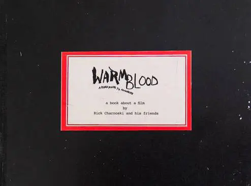 A red-bordered label with the text 'Warmblood' in black handwriting on a white background.